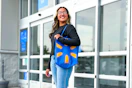 person walking out of Walmart with a Walmart reusable tote