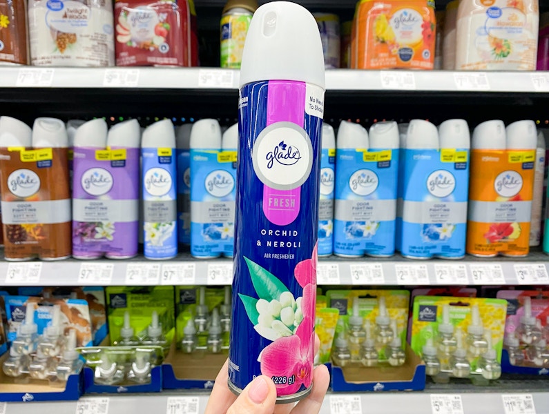 hand holding glade spray in fragrance aisle at walmart