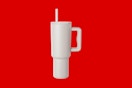 a tumbler on a red background