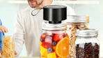 a mason jar sealer on a mason jar full of fruit