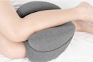 person using knee pillow