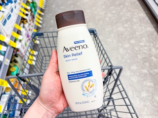 hand holding aveeno skin relief body wash in walgreens