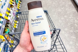 hand holding aveeno skin relief body wash in walgreens