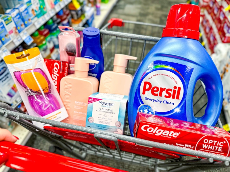 cart with beauty tools, toothpaste, shampoo, lotion, monistat wipes, and persil detergent