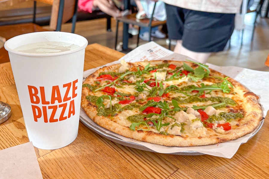 a pizza and drink on a table at Blaze Pizza