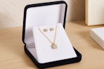 a yellow gold necklace and earring set