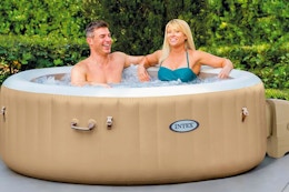 a couple sitting in a tub