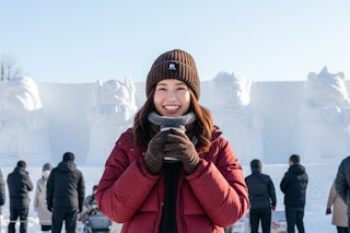 a woman wearing an outdoor accessory set