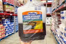 hand holding a pack of hefty food storage containers