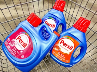 three bottles of persil in a shopping cart together