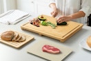 a person chopping on cutting board