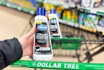 hand holding carbona ceramic cooktop cleaner above dollar tree cart