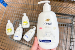 hand holding a Deep Moisture bottle of Dove hand wash