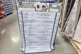 washable rugs hanging from a shopping cart