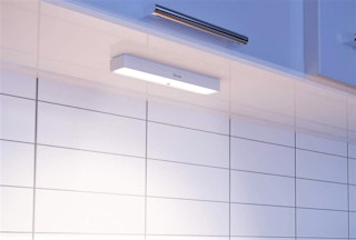 A Govee light under a kitchen cabinet.