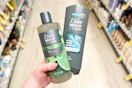 hand holding two Dove Men+Care body washes in a store aisle