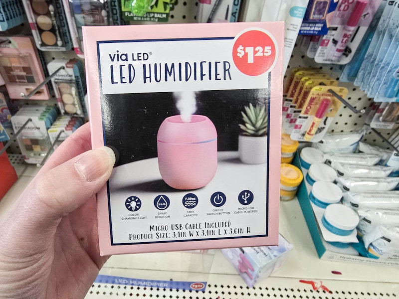 person holding a pink led humidifier