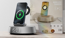 a phone sitting on an alarm clock charging station