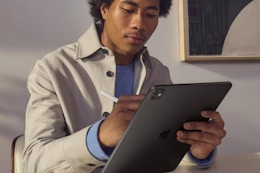 a man using an apple pencil pro