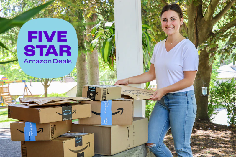 a woman carrying amazon boxes