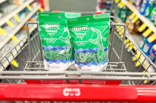 2 bags of floss picks in a cart