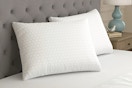Lifestyle image of the Sealy Essentials All Positions Bed Pillow Set in bedroom setting