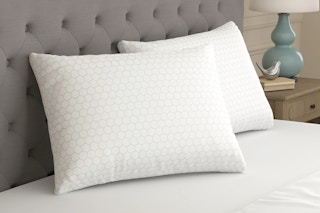 Lifestyle image of the Sealy Essentials All Positions Bed Pillow Set in bedroom setting