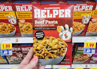 hand holding box of hamburger helper at kroger