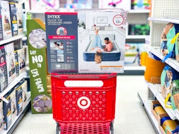 intex queen air mattress sitting on a target cart
