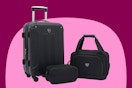a 20-inch black expandable hardside spinner suitcase, a boarding tote and a toiletry kit in black