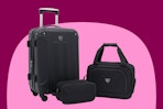 a 20-inch black expandable hardside spinner suitcase, a boarding tote and a toiletry kit in black