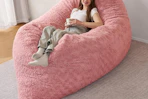 a girl on a giant bean bag chair
