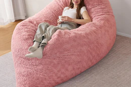 a girl on a giant bean bag chair
