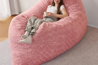a girl on a giant bean bag chair