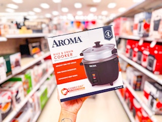 hand holding a 6-cup rice cooker in a target aisle