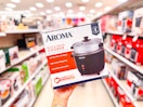 hand holding a 6-cup rice cooker in a target aisle