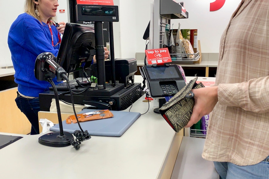 woman purchasing items at tj maxx checkout