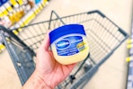 hand holding vaseline healing jelly in walgreens
