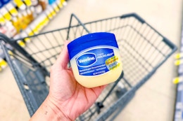 hand holding vaseline healing jelly in walgreens