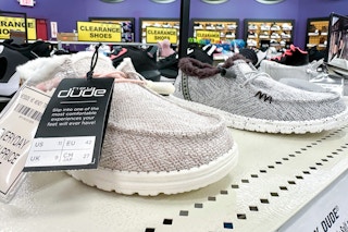 hey dude shoes lined up on display tan and grey