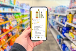 hand holding a smartphone displaying a 1-clip coupon deal