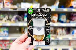 hand holding an air wick advanced warmer
