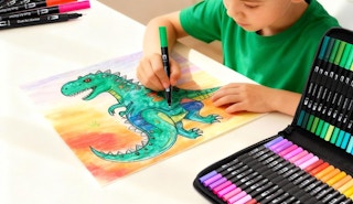 a kid coloring a picture with a marker set