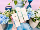 3 Dove Clinical Products with floral arrangements in the background in Walmart store