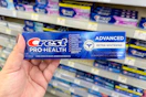 hand holding crest pro-health toothpaste