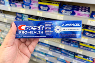 hand holding crest pro-health toothpaste