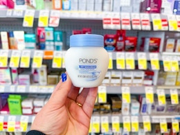 hand holding pond's moisturizer in walgreens