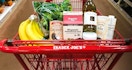 trader joes cart filled with popular products in aisle