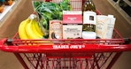trader joes cart filled with popular products in aisle