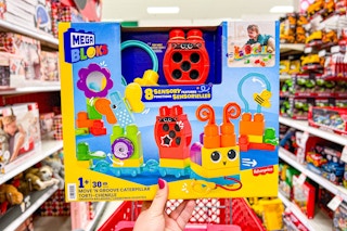 hand holding a mega bloks set in a target aisle